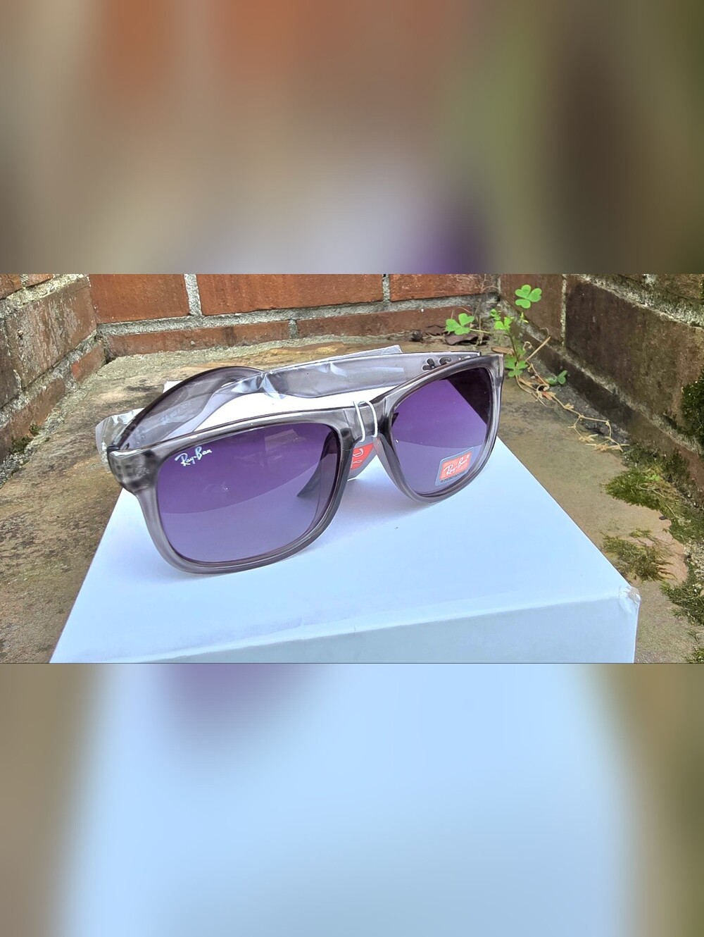 Ray-Ban Translucent Gray Frame Sunglasses with Purple Lenses